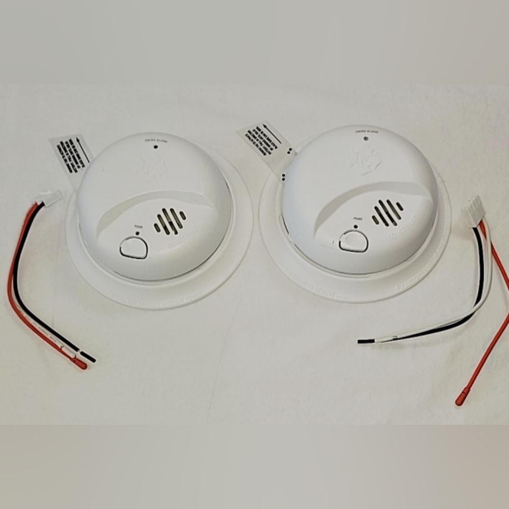 Two First Alert SMI100-AC, Hardwire Interconnect Smoke Alarm with Battery Backup
